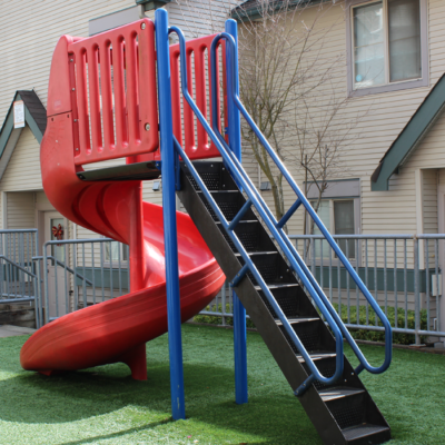 Playground structure with slide