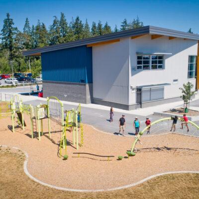 green and silver playground on woodchip surfacing