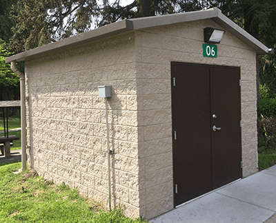 utility building with Split face block walls with cedar shake roof