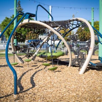 brown, blue, green & black playground on engineered wood fibre (EWF) surfacing