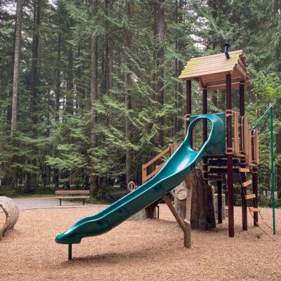 Landscape structure tree house structure (brown and green playground) with engineered wood fibre (EWF) surfacing