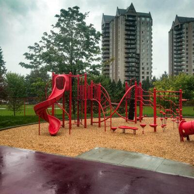 red and black playground on engineered wood fibre (EWF) surfacing