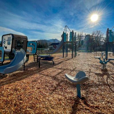 blue, brown, gray and white playground on engineered wood fibre (EWF) surfacing