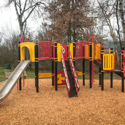 red, yellow and brown playground (Firestation - firetruck theme) with engineered wood fibre (EWF) surfacing