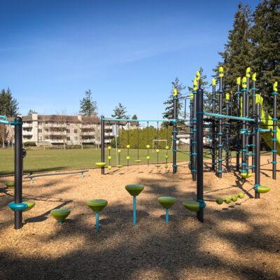 green and blue playground on wood fibre surfacing