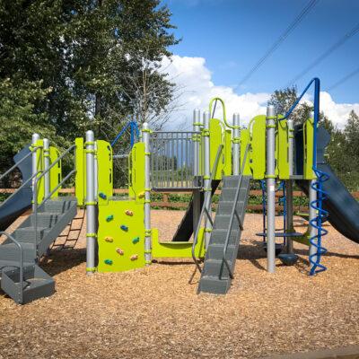 blue, green and gray playground on engineered wood fibre (EWF) surfacing