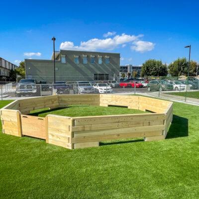 habitat natural playground gaga ball court on artificial grass surfacing