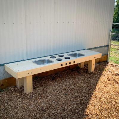 Habitat systems natural play mud kitchen double sink on engineered wood fibre (EWF) Surfacing