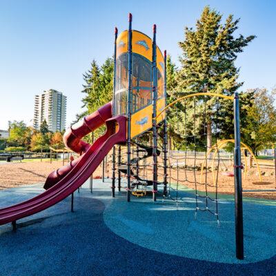 Red, yellow, white & black playground with engineered wood fibre (EWF) , PIP Rubber surfacing