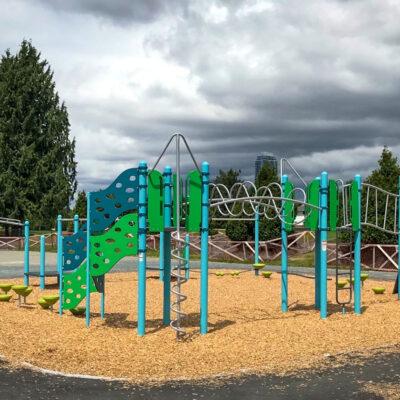 blue, green and silver playground on engineered wood fibre (EWF) surfacing