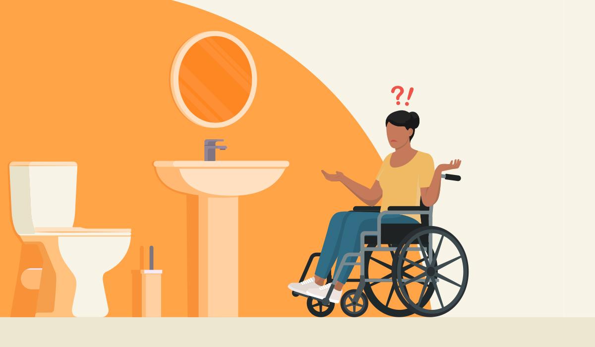 A woman using a wheelchair in a washroom that isn't an accesible washroom building